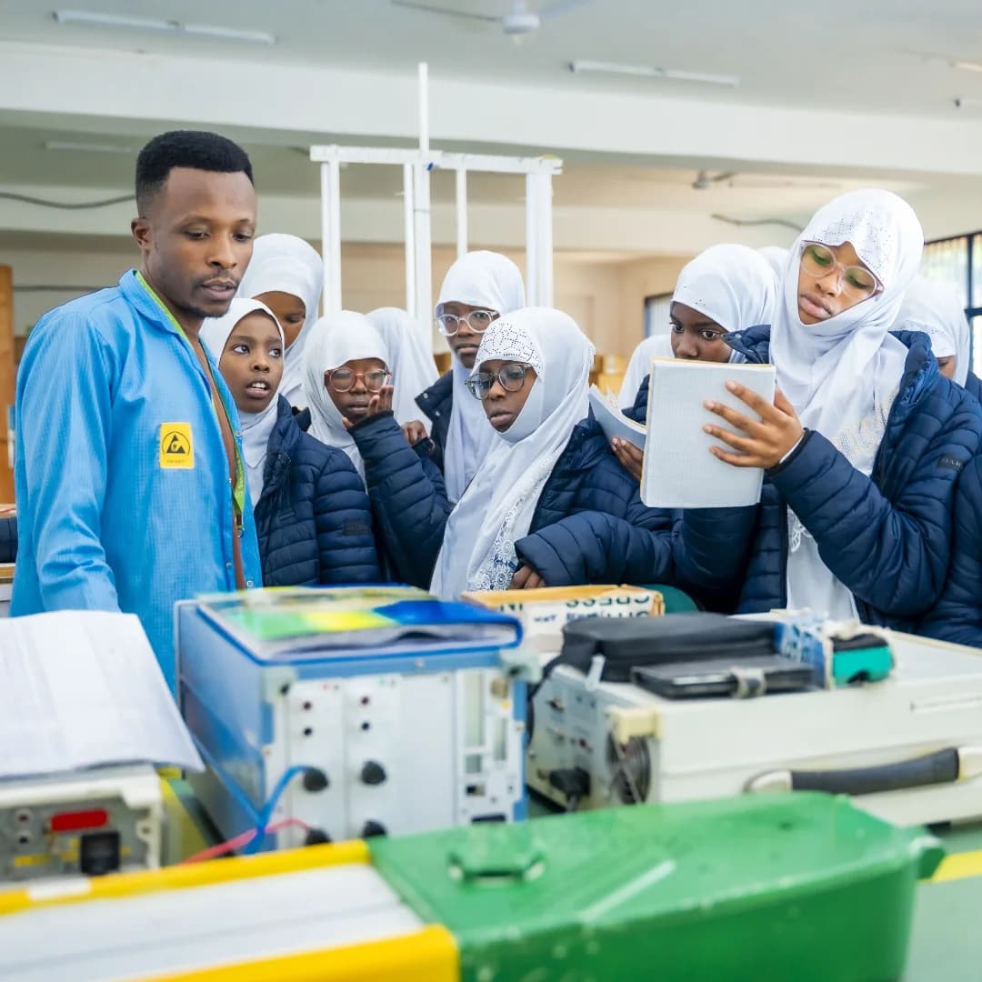 An instructor showing Tamayuz International Academy students laboratory equipment